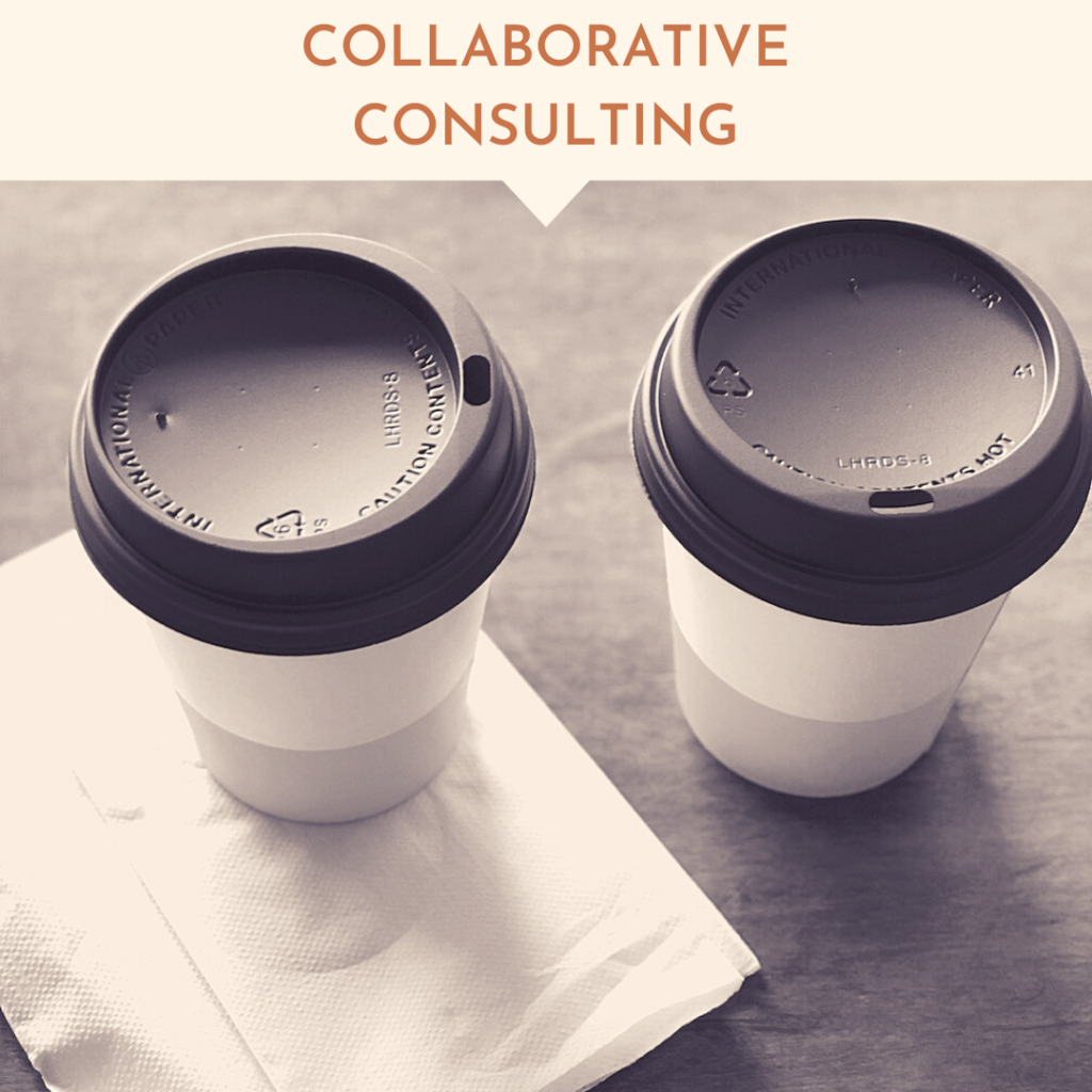 two coffee cups leftover from a successful meeting